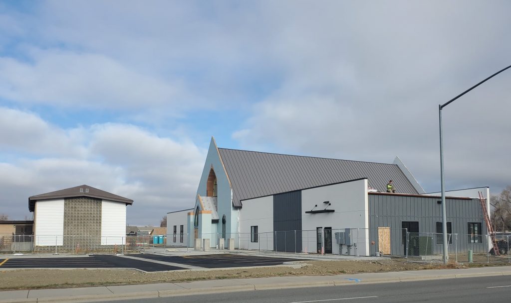 Our old church building (left) that has served us well, and our new church building (right) being constructed